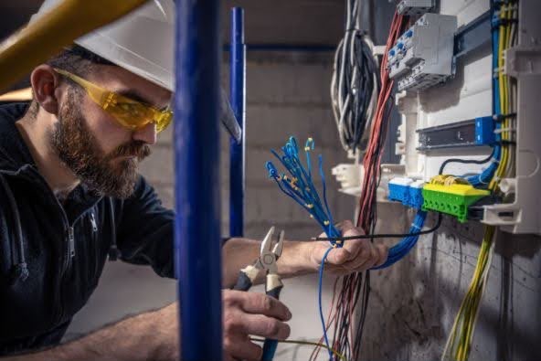 Technician working on electrical wiring