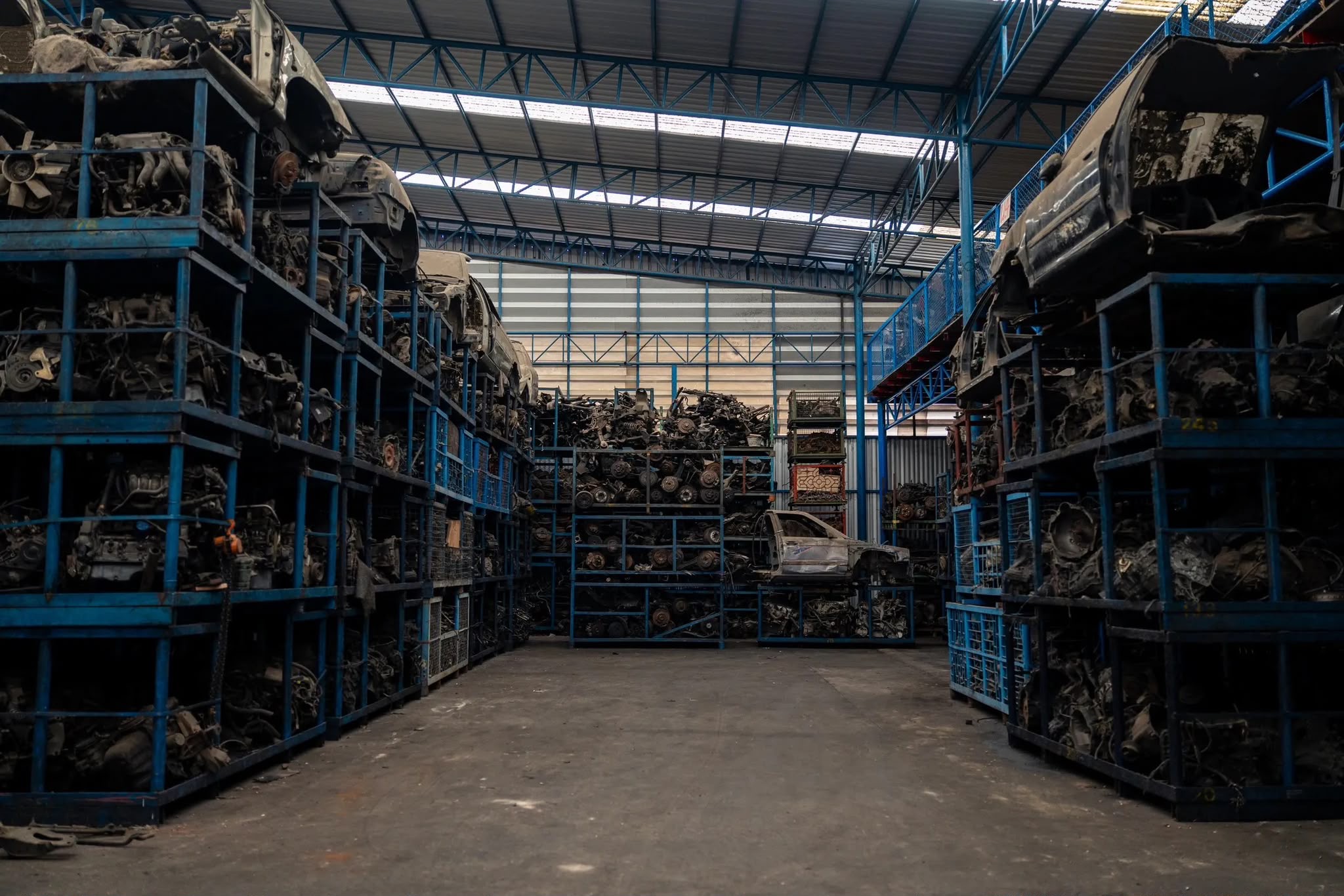 Vehicle parts stored on warehouse shelving